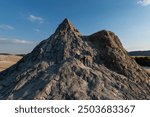 Active mud volcano cone formation near Buzau, Romania. These small, volcano-shaped mounds, usually a few meters tall, result from deep volcanic gas eruptions.