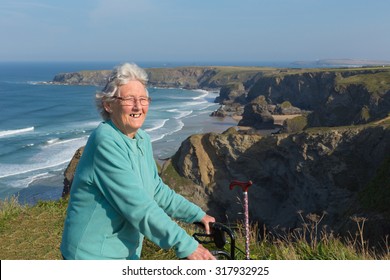 Active Old Lady Pensioner By Beautiful Coastal View In Summer
