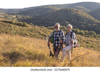 Active old woman and man walking at field and enjoy - Shutterstock ID 2175640075