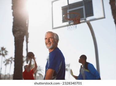 Active older men playing basketball on court - Powered by Shutterstock