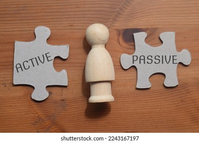 Active and Passive wording on pieces of puzzle  - Shutterstock ID 2243167197