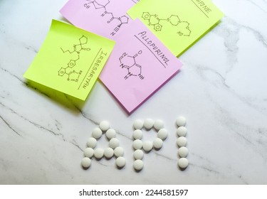 Active Pharmaceutical Ingredient (API) written with pills on white background with hand drawn chemical structure of drug ingredients.