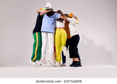 Active Playful Teenagers Hugging After Winning Gold At Hip Hop Dance Competition, Expressing Unity, Human Emotions Youth Love Lifestyle Concept
