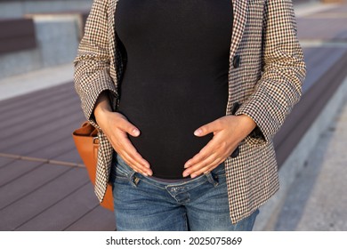 Active Pregnancy Concept. Close-up Of Belly Of Happy Young Business Or Student Pregnant Woman Sitting On The Bench. Future Mom Working Or Studying On Her Late Pregnancy Period.