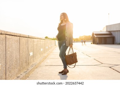 Active Pregnancy Concept. Young Pregnant Business Woman Or Student Sitting On The Bench. Future Mom Working Or Studying On Her Late Pregnancy Period.