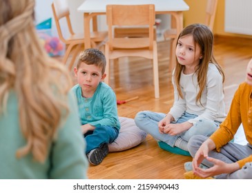 Active Preschool Children Interacting With Their Teacher. Teacher-child Relationships – Early Learning.  Healthy Learning Environment