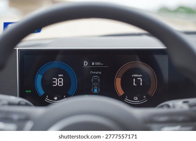 Active Regenerative Braking Telemetry. Dash panel monitors 38 mph velocity alongside battery charging algorithms. Bright azure rings contrast beautifully behind shadowed cabin focal points. USA