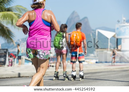 Active residents jog and skate on the beachfront road Avenida Vieira Souto in Ipanema Beach, Rio de Janeiro, Brazil