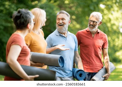 Active Retirement. Happy Group Of Senior People Walking Outdoors After Training, Sporty Mature Men And Women Holding Fitness Mats, Chatting And Laughing, Enjoying Outside Workouts, Closeup - Powered by Shutterstock