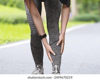 Active runner experiencing shin splints during outdoor exercise, emphasizing fitness and wellness
