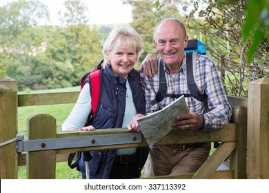 Active Senior Couple On Walk In Countryside - Powered by Shutterstock