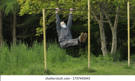 Active Senior Elderly 80 Years Old Caucasian Man Do Morning Stretching Physical Exercises In Sport Playground. Fitness Leisure. Healthy Lifestyle In Coronavirus Quarantine