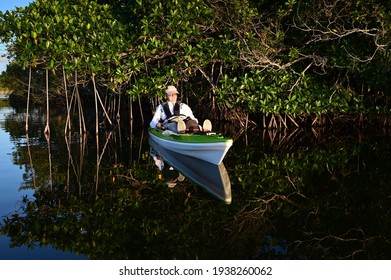 Active Senior Kayaking On Nine Mike Pond In Everglades National Park, Florida.