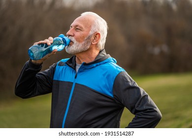 Active senior man is drinking water after exercising. Healthy lifestyle. - Powered by Shutterstock