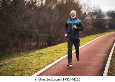Active Senior Man Is Jogging. Healthy Retirement Lifestyle.