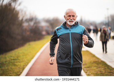 Active Senior Man Is Jogging. Healthy Retirement Lifestyle.