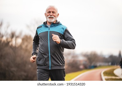 Active senior man is jogging. Healthy retirement lifestyle. - Shutterstock ID 1931514320