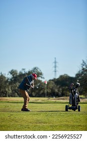 Active senior man playing golf enjoying free time outdoors - Shutterstock ID 2256925527