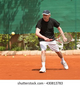 Active Senior Man, Playing Tennis