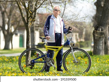 Active senior man resting after bike ride