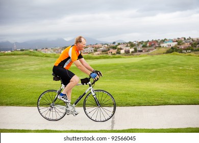 active senior man riding a bicycle