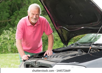 Active senior man working at car - Powered by Shutterstock