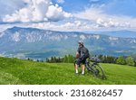 active senior woman on a mountain bike tour in the carinthian alps above Villach in Austria