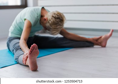 Active Senior Woman Practicing Yoga Indoors. Exercise For Older Adults