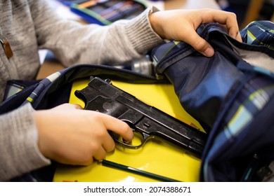 Active shooter taking gun in classroom ready for mass school shooting.
