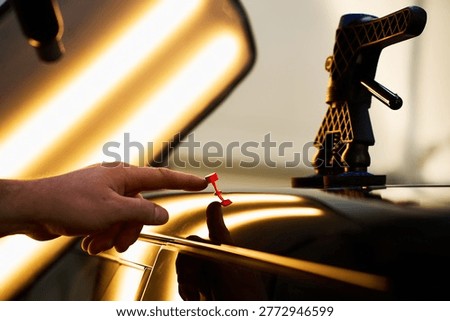 Active slide hammer PDR. Paintless dent repair dynamic glue pulling of tabs outward