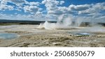 Active volcano and volcanic surface in form of steaming gyser at yellowstone national park