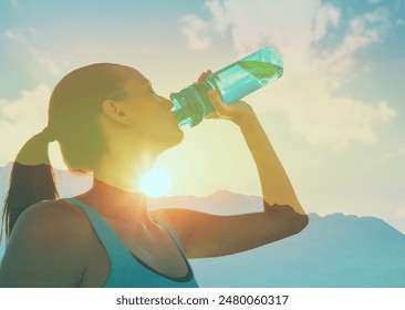 Active woman drinking water staying hydrated - Powered by Shutterstock