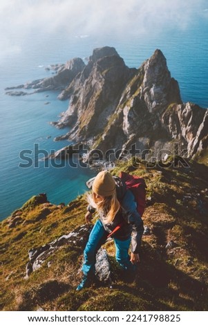 Active woman hiking in Norway travel with backpack trail running outdoor aerial ocean view solo trip healthy lifestyle hobby activity