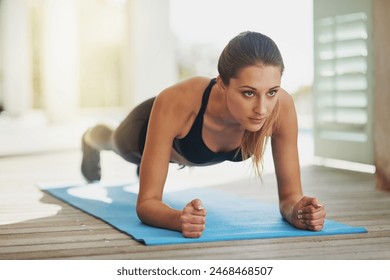 Active, woman and plank workout at house patio for fitness, exercise and pushup cardio for body wellness. Balance, female athlete and training for strong abs, care and muscle power for health goal - Powered by Shutterstock