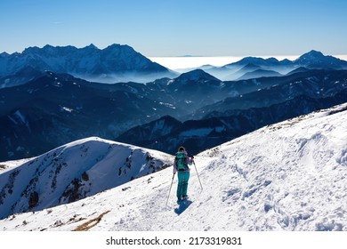 Active Woman Snow Shoe Hiking On A Trail With Scenic View On Snow Capped Mountain Peaks Of Karawanks In Carinthia, Austria. Ski Tour. Julian Alps. Sunny Winter Day. Freedom. Winter Wonderland,Hochobir