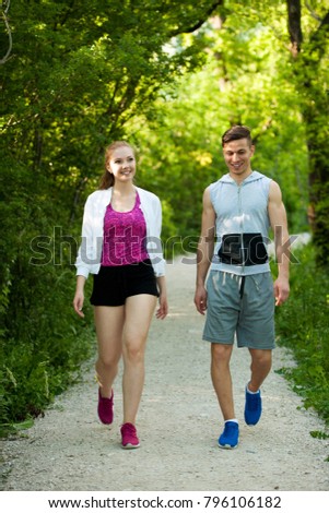 Active young couple on a walk in the park