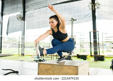 Active Young Woman Doing A Pistol Squat On A Plyo Box During Her Cross Training Workout