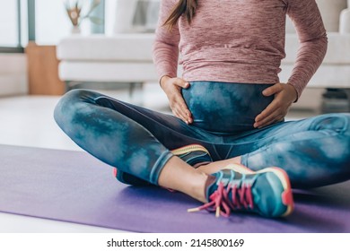 Activewear For Pregnancy. Maternity Clothes Woman Wearing Full Panel Yoga Leggings For Bodyweight Workout At Home On Floor Mat