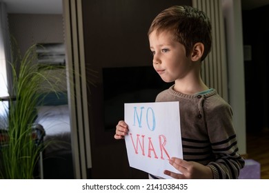 Activism Concept. Request For Help To World Community. Military Protest. Child With Message Stop War. Child Raises A Banner With The Inscription No War. Kids Is Protesting. Caring For Each Other