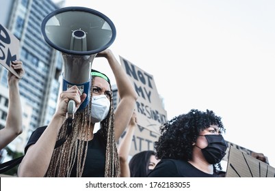 Activist movement protesting against racism and fighting for equality - Demonstrators from different cultures and race protest on street for equal rights - Black lives matter protests city concept