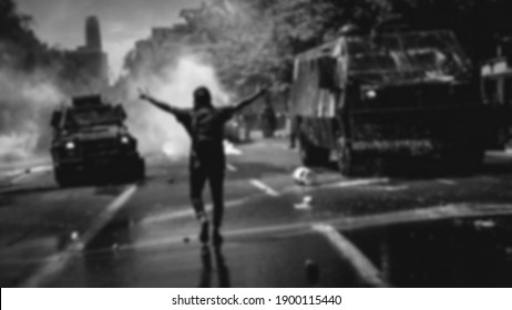 an activist are stand on riot situation with tear gas blur  . black and white blurry background  - Shutterstock ID 1900115440
