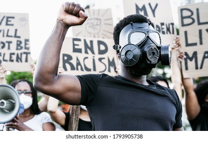 Activist Wearing Gas Mask Protesting Against Racism And Fighting For Equality - Black Lives Matter Demonstration On Street For Justice And Equal Rights - Blm International Movement Concept