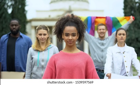 Activists Protesting Against Discrimination Holding Rainbow Flag, LGBT Community