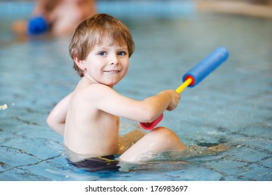 Activities On The Pool, Toddler Boy Swimming, Having Fun And Playing In Water, Indoor