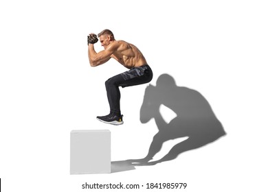 Activity, Jumpbox. Stylish Young Male Athlete On White Studio Background, Portrait With Shadows. Sportive Fit Model In Motion And Action. Body Building, Healthy Lifestyle, Style Concept.