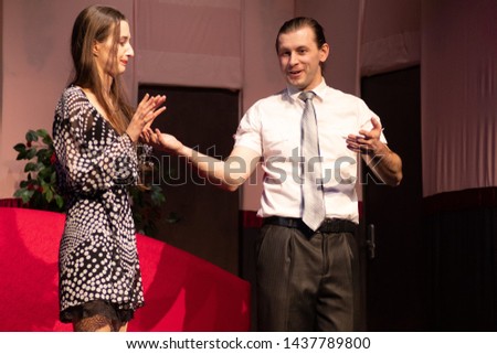 The actor and actress play a romantic comedy, a show performance on the theater stage