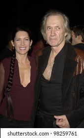 Actor DAVID CARRADINE & Wife At Party At The Pacific Design Center, Los Angeles, To Preview The Latest Products From Hewlett Packard.  30JAN2003.   Paul Smith / Featureflash