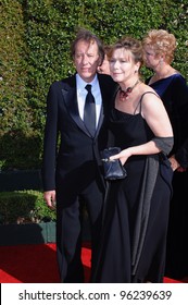 Actor GEOFFREY RUSH & wife at the Creative Arts Emmy Awards in Los Angeles. September 11, 2005; Los Angeles, CA:    Paul Smith / Featureflash