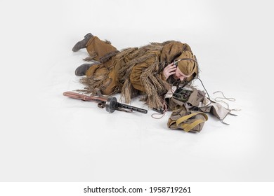 Actor Male Radio Operator Soldier Of The Soviet Army In Old Military Uniform And Camouflage Clothes In Ghillie Suit During World War II