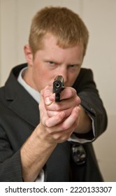 Actor, Man With Imitation Gun Pointing It Forward, Selective Focus On Gun, Firearms Concept, Protection